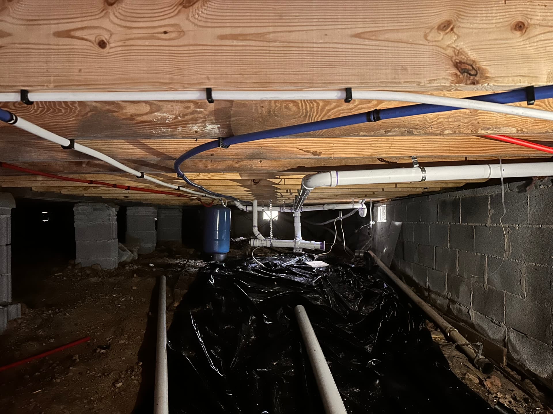 New PEX supply lines and drain piping in a crawlspace repipe