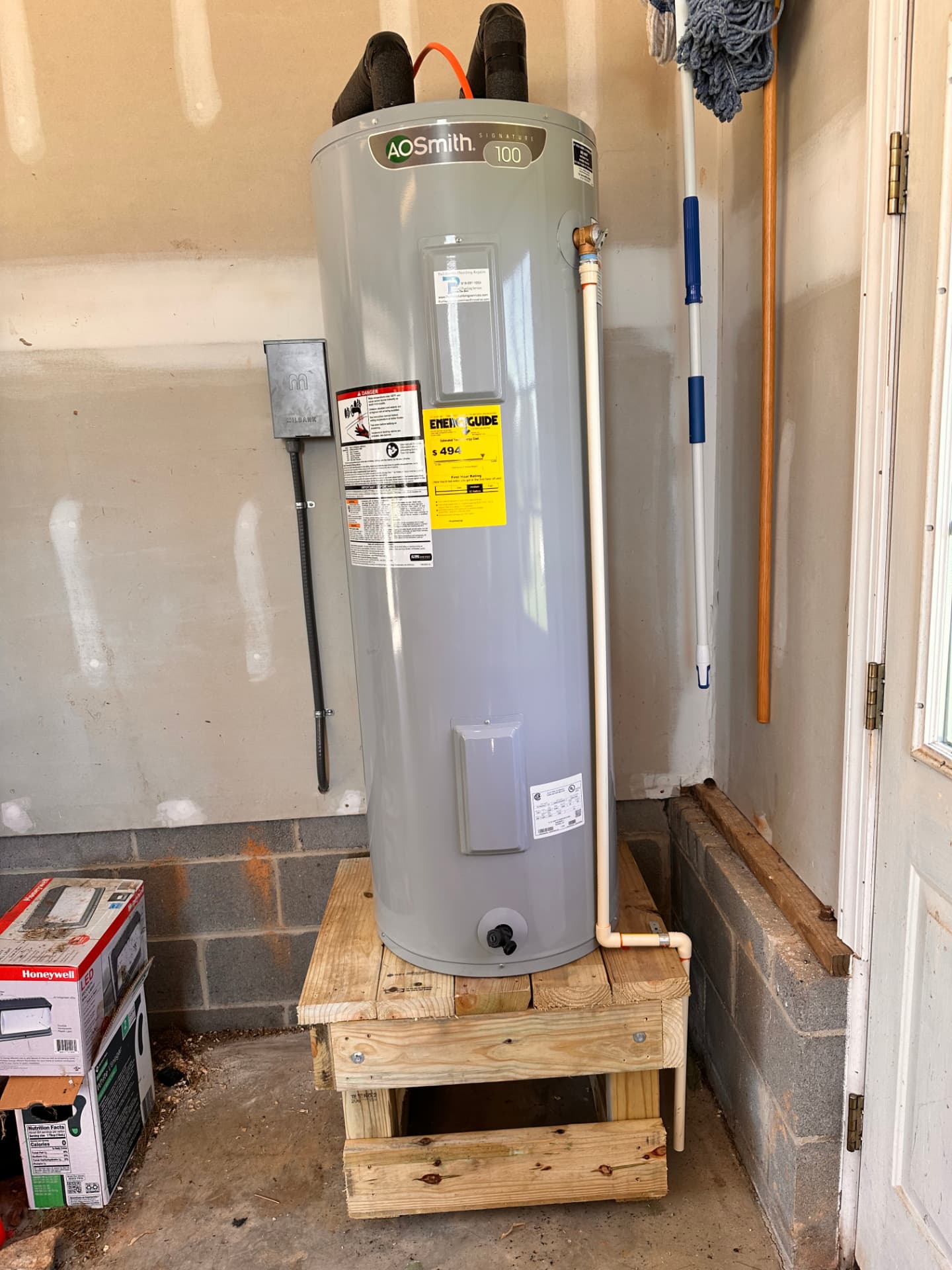 A.O. Smith electric water heater replacement in a garage