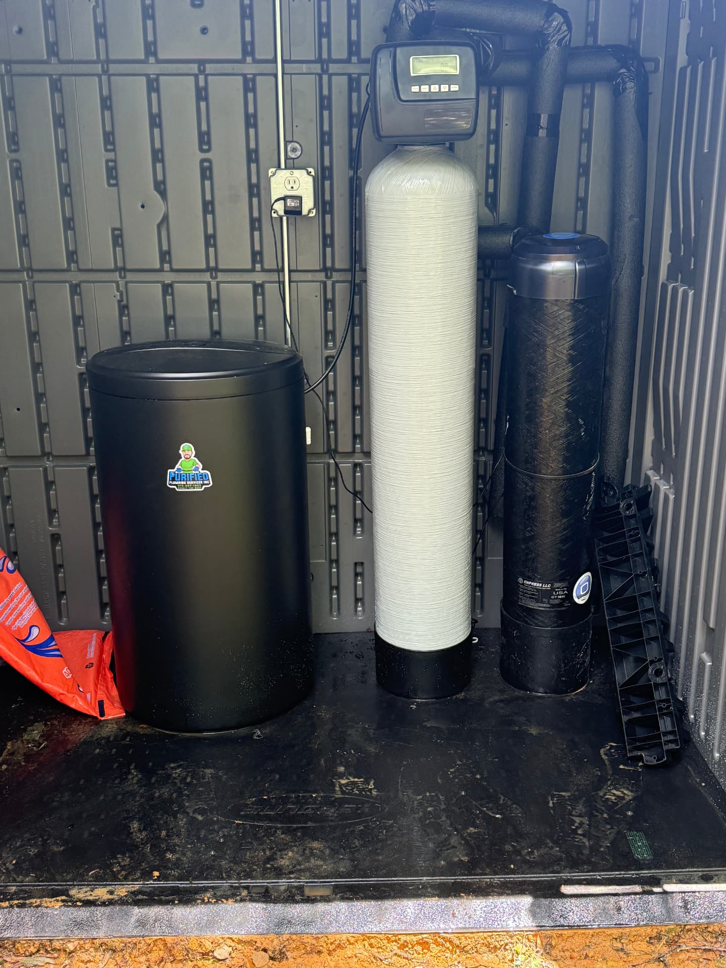 Water softener, brine tank, and carbon filter staged for install