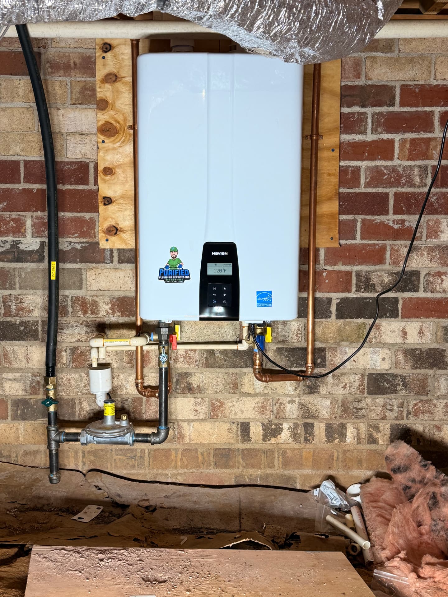 Navien tankless water heater installed in a crawlspace